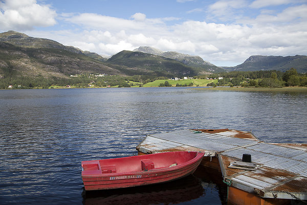 red boat in a fjord