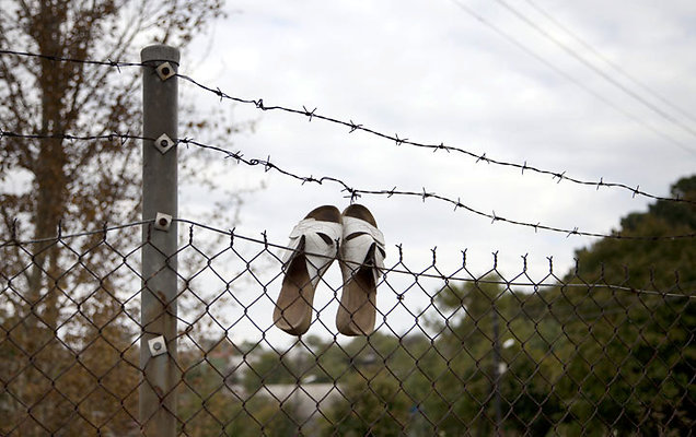 white pumps on fence